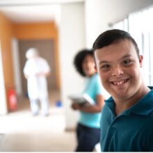 High school aged boy looking into the camera and smiling