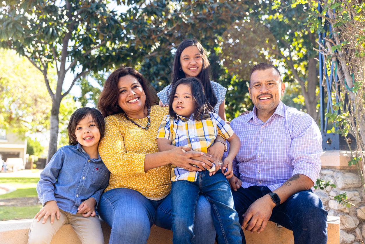 A family poses for photos outside in Colorado