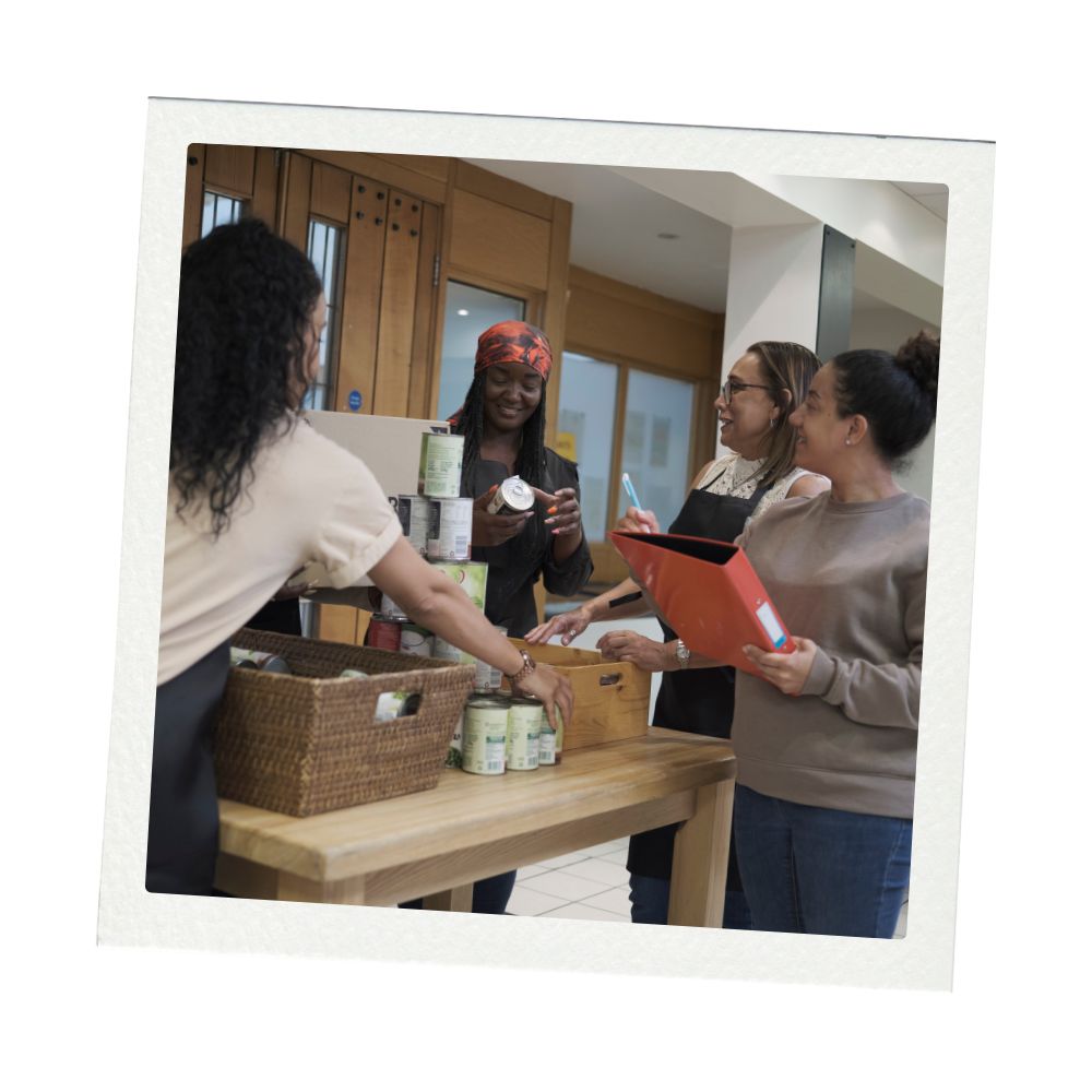 A group of volunteers work to pack holiday food boxes at a food bank in Colorado