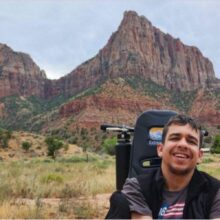 A young man uses an all-terrain wheelchair to explore Colorado and beyond with his friends