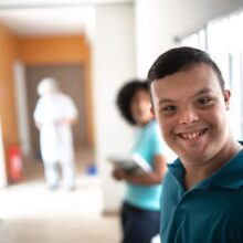 Teenager in a school smiling